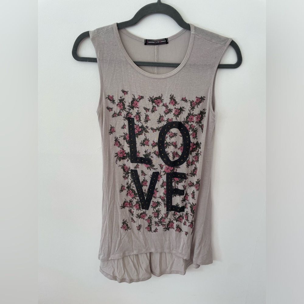 Happening in the present tank top. Size small